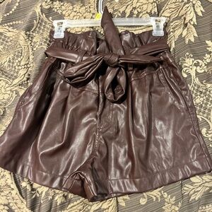 Small reddish brown puffy cute shorts with pockets.